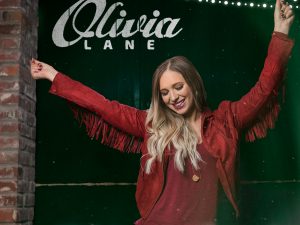 Exclusive: Olivia Lane Premieres “Rockin’ Around The Christmas Tree” New Video